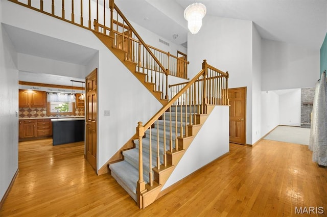 15020 Jamestown Rd, Breese, IL 62230 - stairs with a towering ceiling and wood finished floors