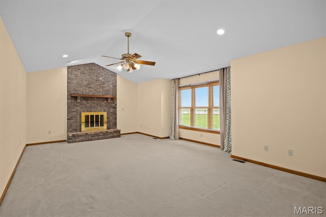 15020 Jamestown Rd, Breese, IL 62230 - unfurnished living room featuring ceiling fan, vaulted ceiling, carpet floors, a brick fireplace, and recessed lighting