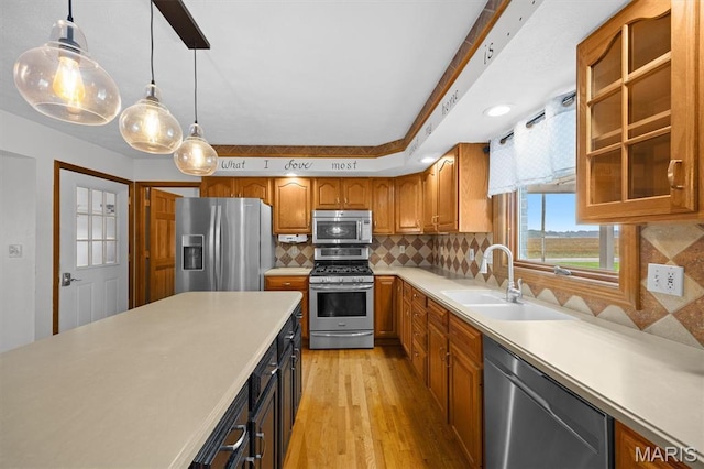 15020 Jamestown Rd, Breese, IL 62230 - kitchen with appliances with stainless steel finishes, light wood finished floors, light countertops, tasteful backsplash, and brown cabinets
