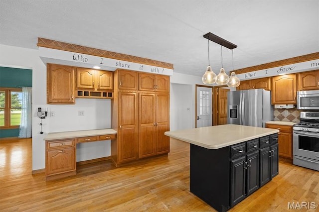 15020 Jamestown Rd, Breese, IL 62230 - kitchen with appliances with stainless steel finishes, light countertops, and light wood finished floors
