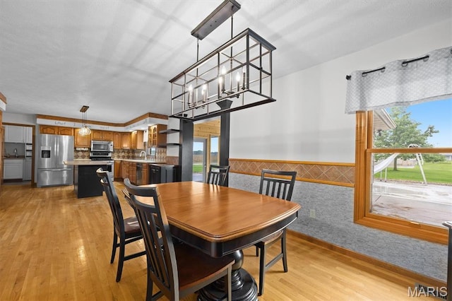 15020 Jamestown Rd, Breese, IL 62230 - dining space featuring light wood-style flooring, plenty of natural light, and wainscoting