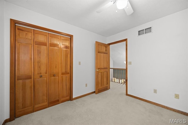 15020 Jamestown Rd, Breese, IL 62230 - unfurnished bedroom with light colored carpet, a ceiling fan, and a closet