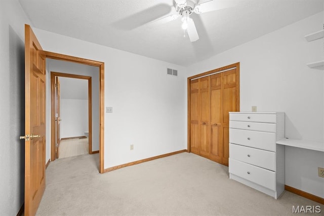 15020 Jamestown Rd, Breese, IL 62230 - unfurnished bedroom with light colored carpet, a closet, and ceiling fan
