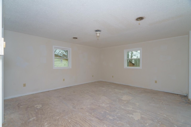 15020 Hackney Dr, Saint Robert, MO 65584 - unfurnished room featuring a textured ceiling, baseboards, and light wood-style floors