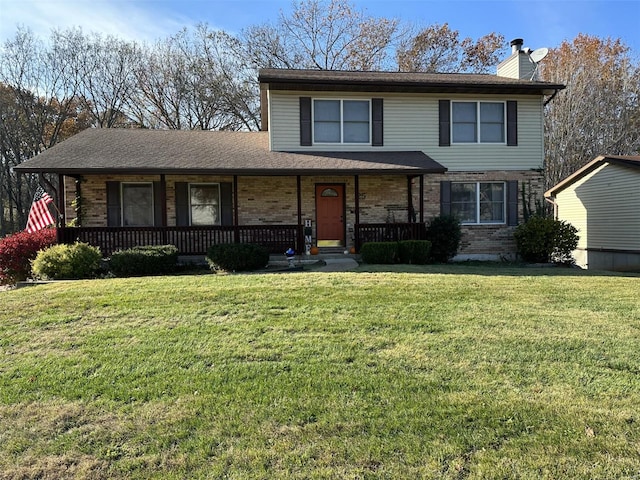 25 Whispering Oaks Dr, Washington, MO 63090 - traditional home with a porch, a chimney, and brick siding