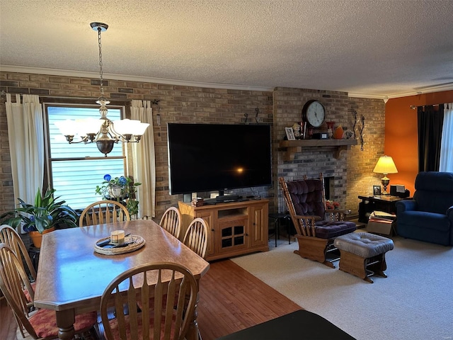 25 Whispering Oaks Dr, Washington, MO 63090 - living room with a textured ceiling, brick wall, a chandelier, crown molding, and a fireplace