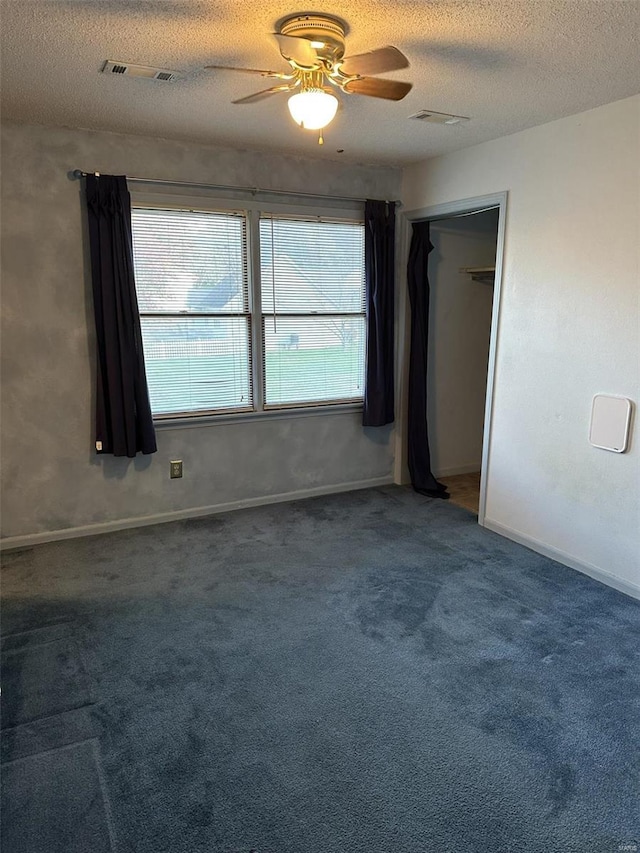 25 Whispering Oaks Dr, Washington, MO 63090 - spare room featuring carpet, a ceiling fan, a textured ceiling, and baseboards
