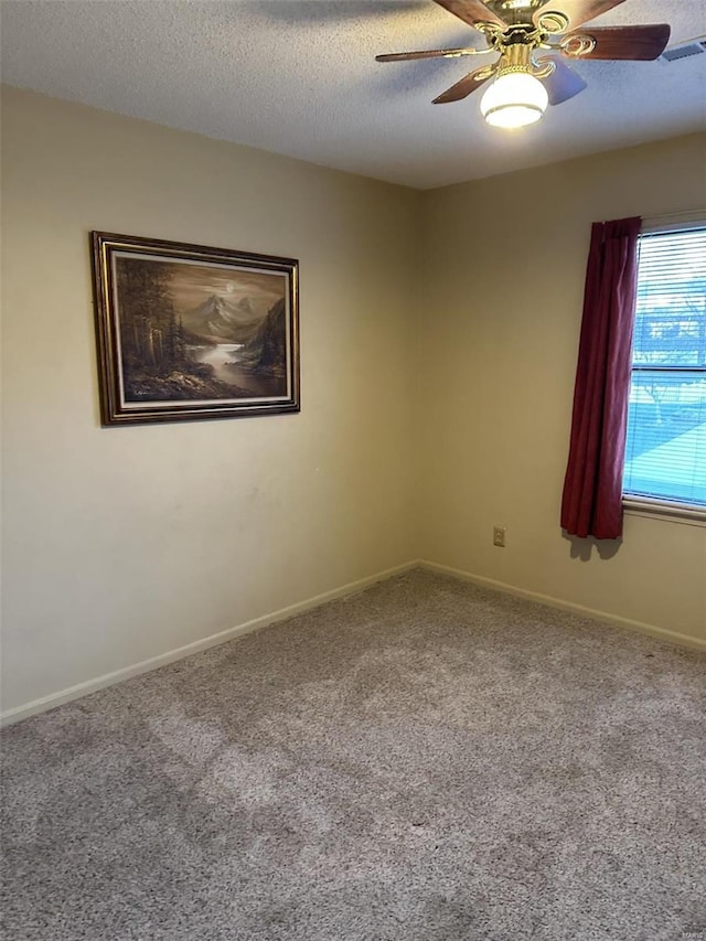 25 Whispering Oaks Dr, Washington, MO 63090 - carpeted spare room with ceiling fan, a textured ceiling, and baseboards