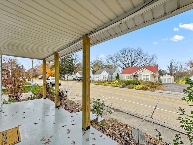 view of patio / terrace with a residential view and a porch