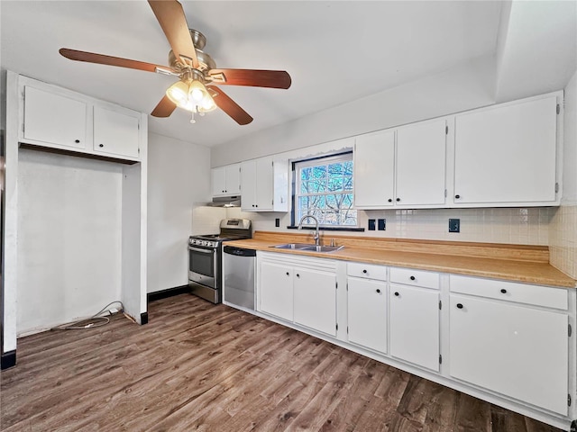 kitchen with a sink, stainless steel appliances, under cabinet range hood, white cabinets, and ceiling fan