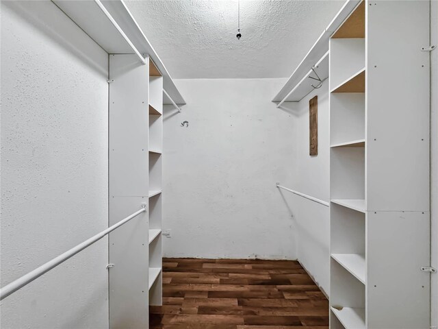 spacious closet with wood finished floors