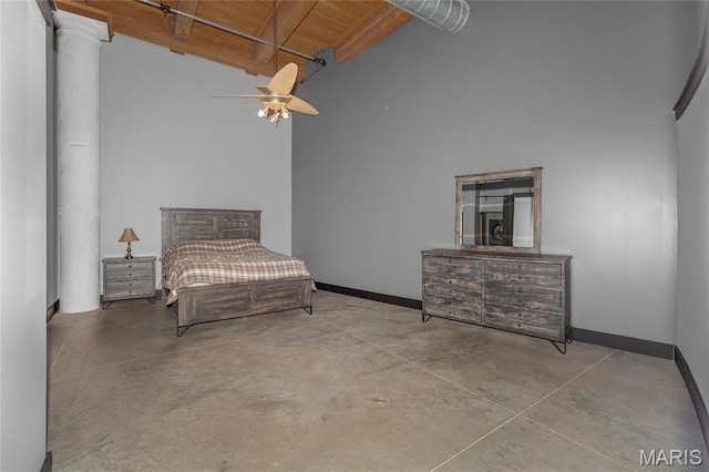 1113 Washington Ave Unit 215, Saint Louis, MO 63101 - bedroom featuring finished concrete flooring, ceiling fan, beam ceiling, and high vaulted ceiling
