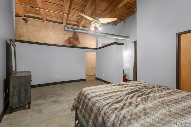 1113 Washington Ave Unit 215, Saint Louis, MO 63101 - bedroom featuring a wooden ceiling with exposed beams, concrete floors, and a towering ceiling
