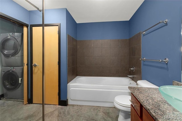 1113 Washington Ave Unit 215, Saint Louis, MO 63101 - bathroom featuring stacked washer / dryer, vanity, and concrete flooring