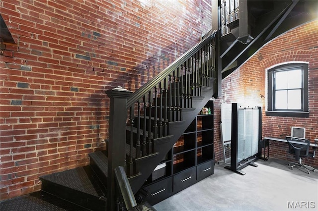1113 Washington Ave Unit 215, Saint Louis, MO 63101 - staircase with brick wall