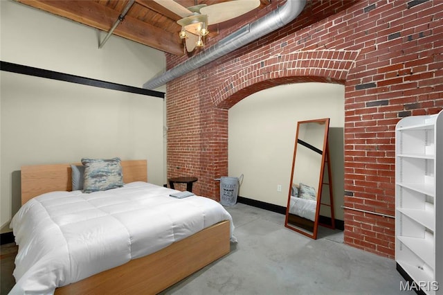 1113 Washington Ave Unit 215, Saint Louis, MO 63101 - bedroom with brick wall and concrete flooring