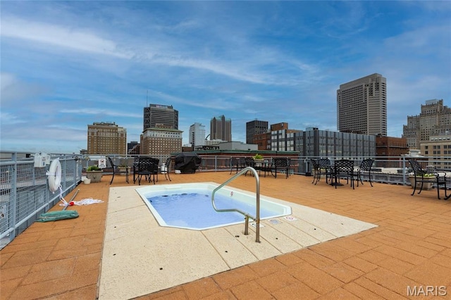 1113 Washington Ave Unit 215, Saint Louis, MO 63101 - view of swimming pool with a skyline view and area for grilling