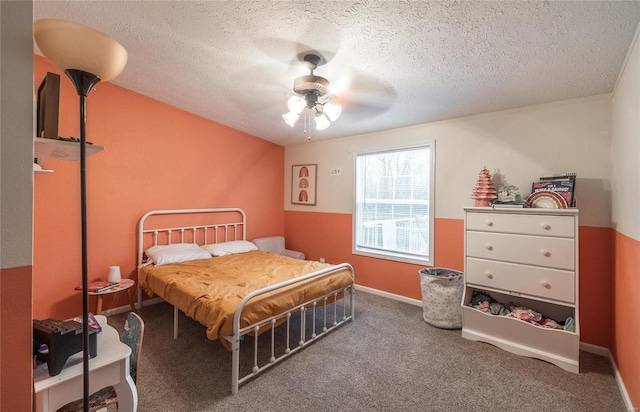 704 Ogle Dr, Richland, MO 65556 - carpeted bedroom with a textured ceiling, ceiling fan, and baseboards