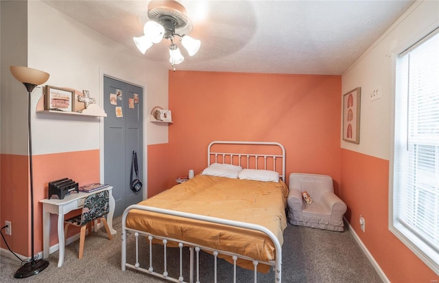 704 Ogle Dr, Richland, MO 65556 - carpeted bedroom featuring multiple windows, a ceiling fan, and baseboards
