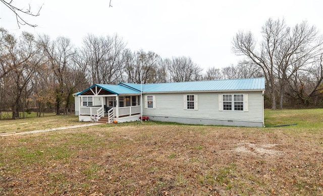704 Ogle Dr, Richland, MO 65556 - manufactured / mobile home with crawl space, a porch, metal roof, and a front yard
