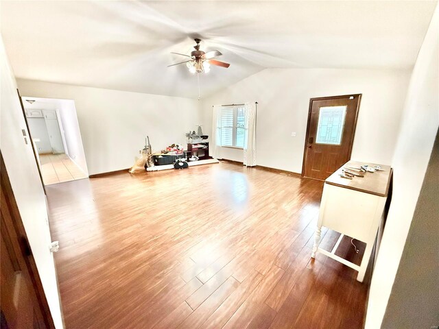 2560 Birch St, Doe Run, MO 63637 - living area featuring wood finished floors, a ceiling fan, vaulted ceiling, and baseboards