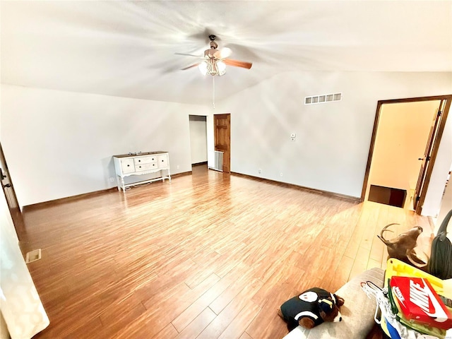 2560 Birch St, Doe Run, MO 63637 - unfurnished living room featuring vaulted ceiling, ceiling fan, wood finished floors, and baseboards