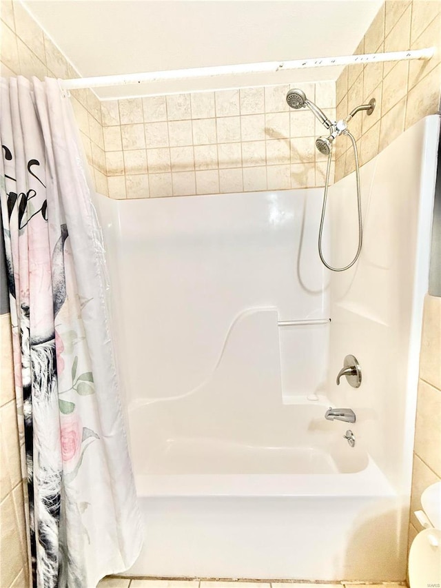 2560 Birch St, Doe Run, MO 63637 - full bath featuring shower / bath combination with curtain and tile walls