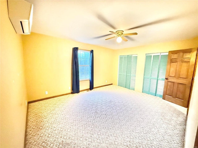 2560 Birch St, Doe Run, MO 63637 - carpeted spare room featuring a ceiling fan, a wall mounted AC, and baseboards