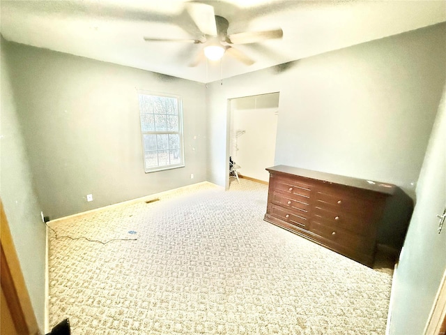 2560 Birch St, Doe Run, MO 63637 - unfurnished bedroom with carpet floors, ceiling fan, baseboards, a spacious closet, and a closet