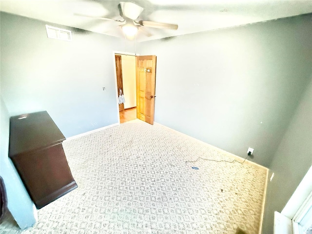 2560 Birch St, Doe Run, MO 63637 - unfurnished bedroom featuring carpet, a ceiling fan, and baseboards