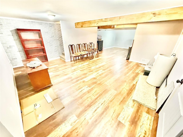 2560 Birch St, Doe Run, MO 63637 - living room featuring wood finished floors, baseboards, and brick wall