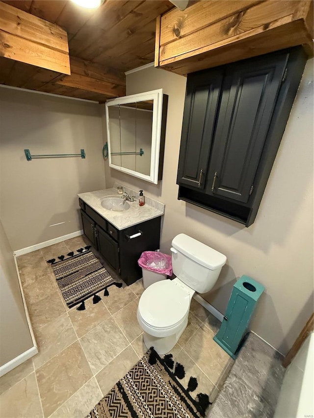 2560 Birch St, Doe Run, MO 63637 - bathroom with wooden ceiling, toilet, vanity, and baseboards