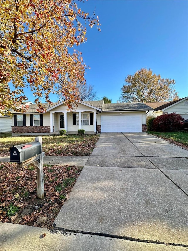 926 Justice Ct, Florissant, MO 63034 - ranch-style house featuring an attached garage, concrete driveway, and brick siding