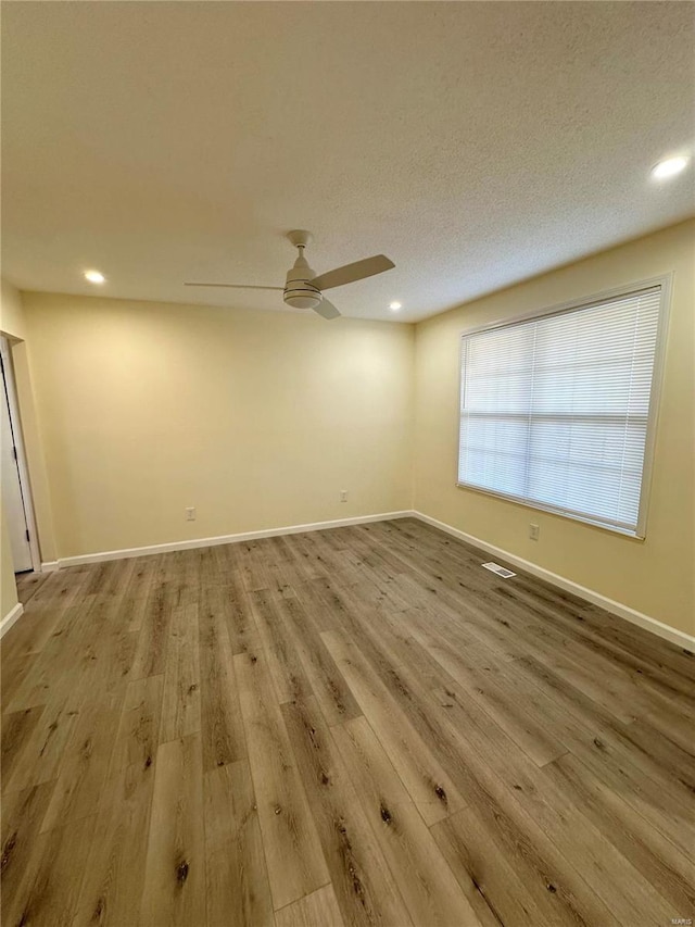926 Justice Ct, Florissant, MO 63034 - unfurnished room with ceiling fan, wood finished floors, baseboards, and recessed lighting