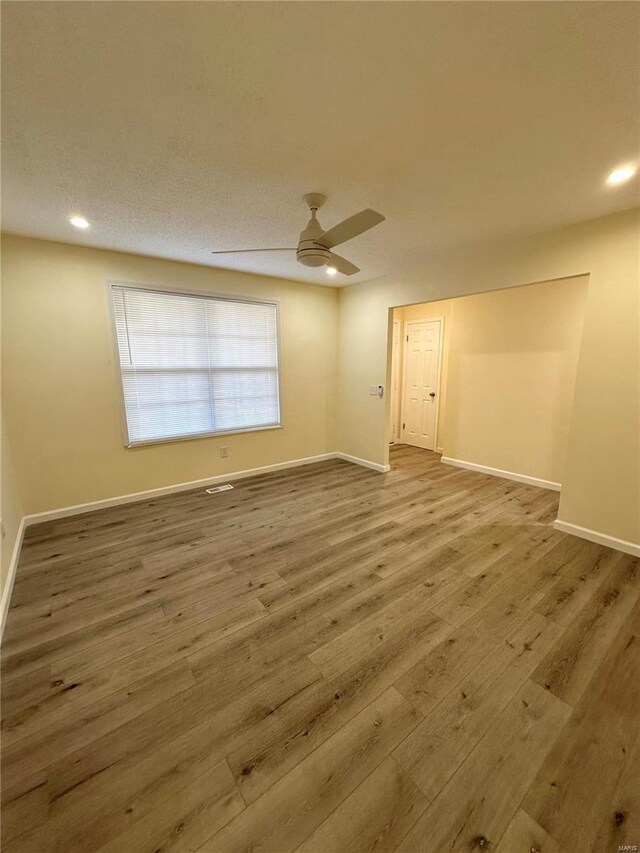 926 Justice Ct, Florissant, MO 63034 - unfurnished room featuring wood finished floors, ceiling fan, baseboards, and recessed lighting