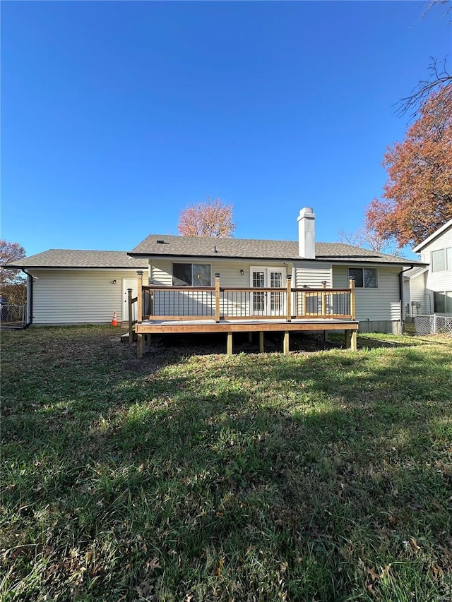 926 Justice Ct, Florissant, MO 63034 - rear view of property featuring a wooden deck, a lawn, and a chimney