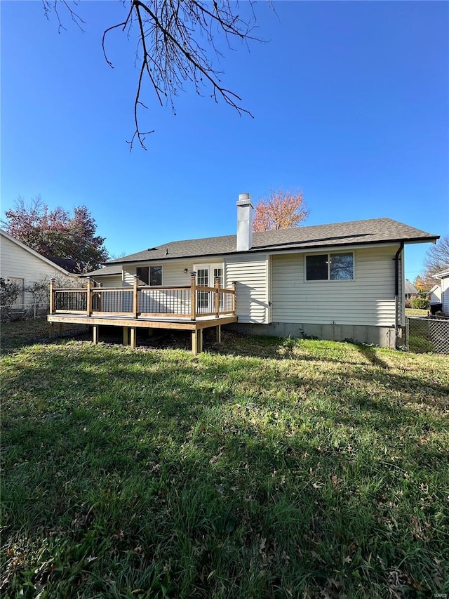 926 Justice Ct, Florissant, MO 63034 - rear view of house with a wooden deck and a chimney