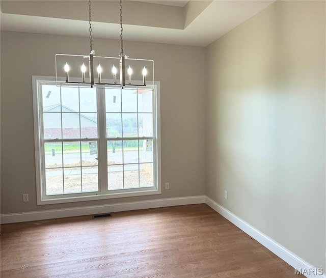 1905 Wheelwright Dr, Cape Girardeau, MO 63701 - unfurnished dining area featuring baseboards, a chandelier, and wood finished floors