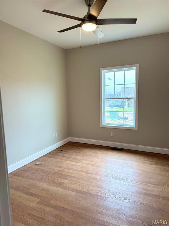 1905 Wheelwright Dr, Cape Girardeau, MO 63701 - unfurnished room featuring a ceiling fan, baseboards, and wood finished floors