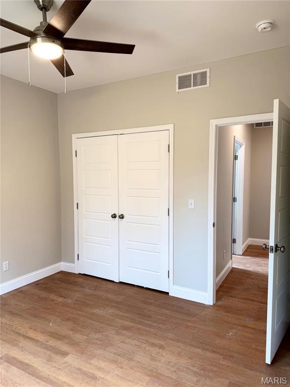 1905 Wheelwright Dr, Cape Girardeau, MO 63701 - unfurnished bedroom with light wood-type flooring, baseboards, and a closet