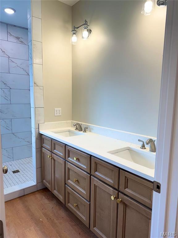 1905 Wheelwright Dr, Cape Girardeau, MO 63701 - full bath featuring a stall shower, wood finished floors, and double vanity