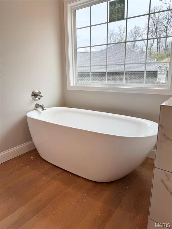 1905 Wheelwright Dr, Cape Girardeau, MO 63701 - full bathroom with wood finished floors, a freestanding bath, and baseboards