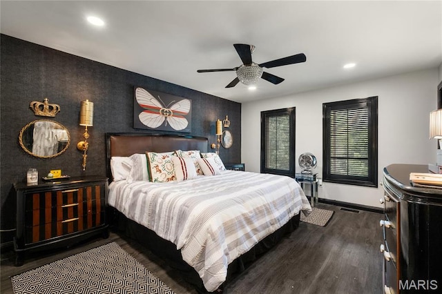 bedroom featuring baseboards, wood finished floors, recessed lighting, and a ceiling fan