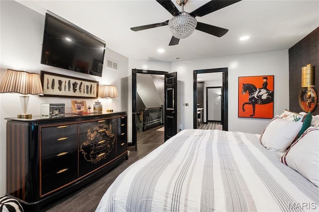 bedroom with recessed lighting and dark wood-style flooring