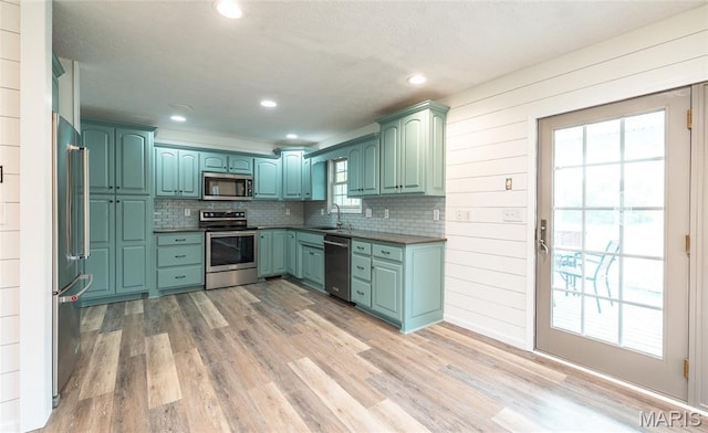 14280 County Road 8100, Rolla, MO 65401 - kitchen with appliances with stainless steel finishes, healthy amount of natural light, tasteful backsplash, recessed lighting, and a textured ceiling