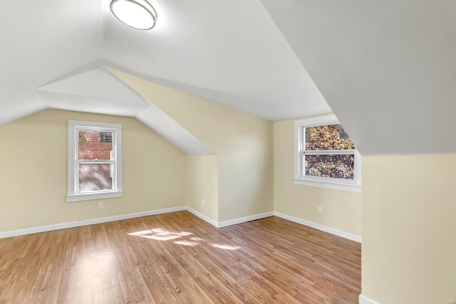 4327 Nelson Dr, Saint Louis, MO 63121 - bonus room with light wood-style floors, lofted ceiling, healthy amount of natural light, and baseboards