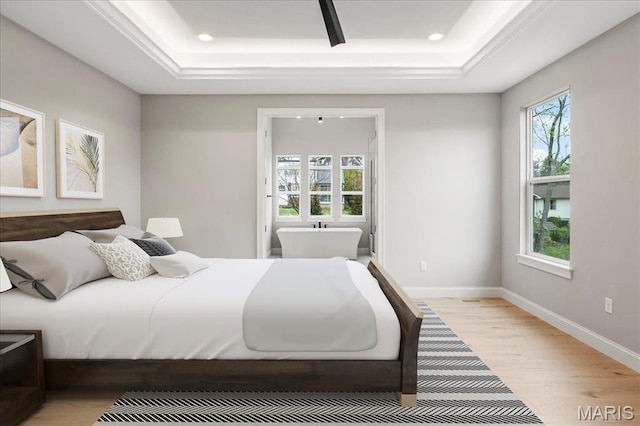 19 Beaver Dr, Creve Coeur, MO 63141 - bedroom featuring a tray ceiling, light wood-type flooring, recessed lighting, and baseboards