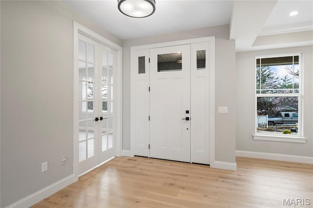 19 Beaver Dr, Creve Coeur, MO 63141 - foyer with french doors, baseboards, and light wood-type flooring