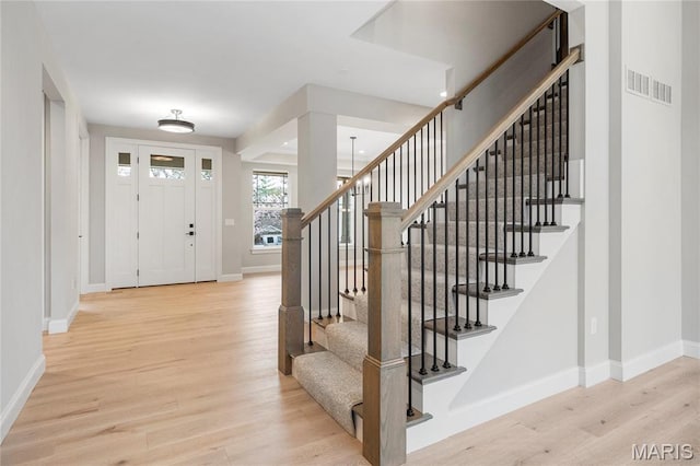 19 Beaver Dr, Creve Coeur, MO 63141 - foyer with baseboards, wood finished floors, and stairway