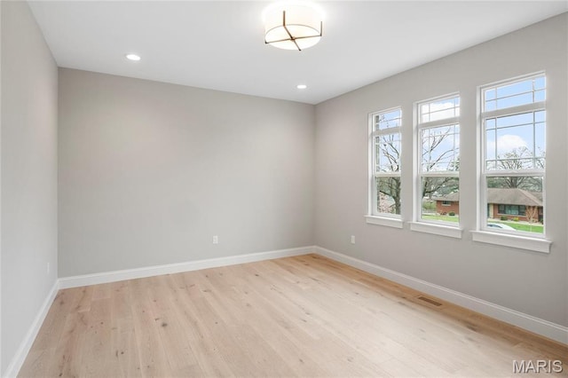 19 Beaver Dr, Creve Coeur, MO 63141 - spare room featuring light wood-style flooring, baseboards, and recessed lighting